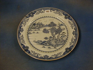 An antique Oriental blue and white porcelain plate with stylised floral pattern 14"