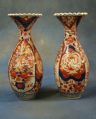 A pair of 19th Century Japanese Imari porcelain club shaped vases with flared mouths 15" (1 f) 