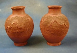 A pair of 19th Century Oriental Tanware vases decorated dragons, 12" the base with seal mark