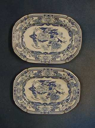 A pair of 19th Century Masons blue and white china lozenge shaped sauce boat stands 9", the reverse marked Masons patented Ironstone china