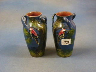 A pair of Devonware pottery vases decorated parrots 6"