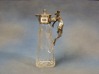 An Art Nouveau cut glass claret jug the silver plated handle in the form of a fairy with glass 10"