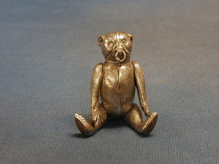 An Edwardian silver articulated pin cushion in the form of a muzzled bear with a ring through its nose, Birmingham 1901, makers mark H.V.P&Co RD no. 537681