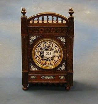 A Victorian 8 day striking mantel clock with blue floral porcelain dial contained in an oak case 