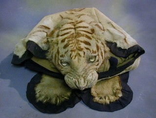 A tiger skin by Van Ingen & Van Ingen with khaki back cloth (some wear)