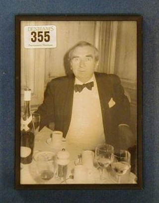 A black and white photograph of Dennis Healey in a restaurant wearing black tie