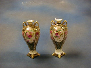 A pair of Noritake twin handled porcelain vases with floral and gilt decoration 10" (1 foot f and r) 