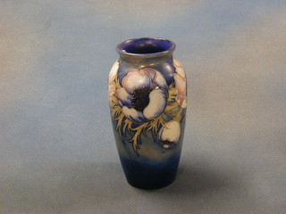 A Moorcroft blue glazed  Anemone      pattern vase, the base with signature mark, Potter to HM The Queen, Made in England, 8" circa 1949