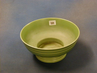 A green glazed Wedgwood Keith Murray circular pedestal bowl, the base impressed Wedgwood Keith Murray Made in England, 10" (chip to base)