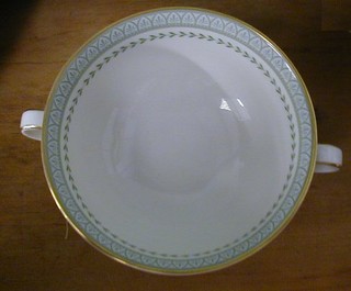 A 64 piece Royal Doulton Berkshire pattern tea service comprising 2 oval meat plates, 8 dinner plates, 8 side plates, 8 tea plates, 7 dessert bowls, 8 twin handled soup bowls and saucers, sauce boat and stand, 6 saucers, 4 cups, sugar bowl, cream jug and teapot