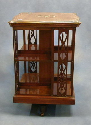 An Edwardian inlaid mahogany square revolving bookcase 21"