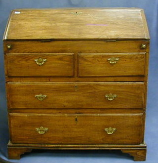 A 17th/18th Century elm bureau, the fall front fitted a well and with stepped interior above 2 short and 2 long drawers, raised on bracket feet 37"