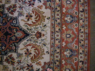 A  Persian style floral patterned carpet 162" x 118"
