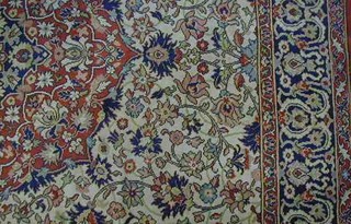 A Persian style floral patterned carpet 123" x 108"