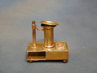 A 19th Century brass chamber stick with match slip