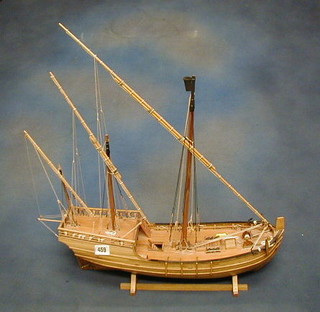 A wooden model of a three masted "Port Ship"