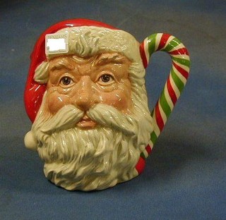 A large Royal Doulton character jug, Santa Claus with green and white candy stick handle, base marked D6840, special edition, of 1000 American Collector's Society