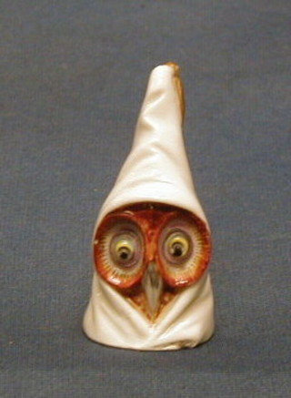 A Victorian Royal Worcester porcelain candle snuffer in the form of an owl with night cap 3" (slight chip to base) the interior with red Royal Worcester mark