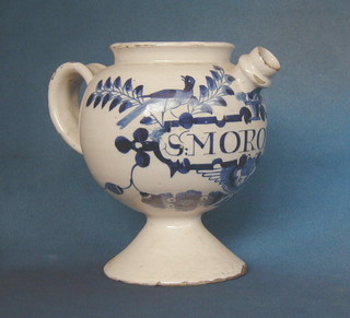A 17th/18th Century Delft blue and white drug jar, raised on a circular foot, marked Smororu 8"