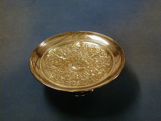 An impressive Edwardian circular silver plated embossed tazza decorated warring scenes 9 1/2"