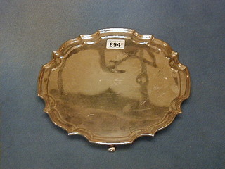A circular silver plated salver with bracketed border by Mappin & Webb 10"