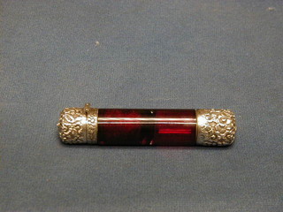 A Victorian red glass double ended scent phial with embossed "silver" lids 4"