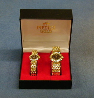 A lady's and gentleman's gold plated wristwatch by Medici, cased