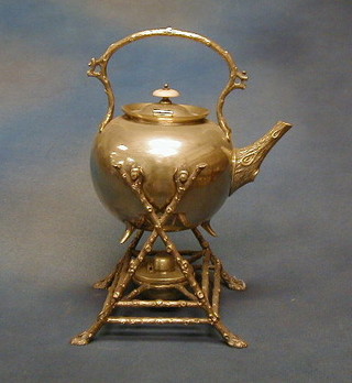 A silver plated spirit kettle raised on crab stock supports