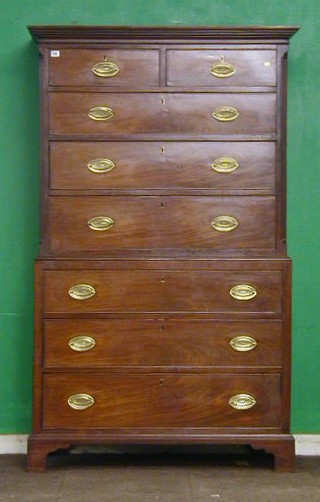 A Georgian mahogany chest on chest, the upper section with moulded cornice above 2 short and 3 long graduated drawers, the base fitted 3 long drawers, raised on bracket feet 42"