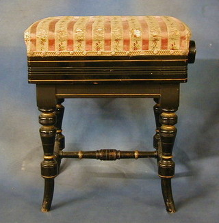 A Victorian ebonised adjustable piano stool on turned supports with H framed stretcher