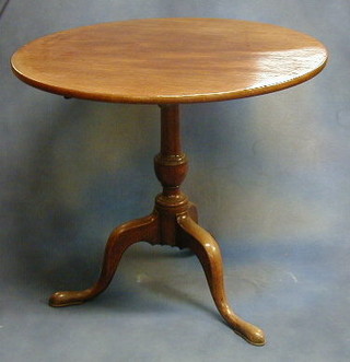 A  Georgian mahogany circular snap top tea table raised on pillar and tripod supports 31" 