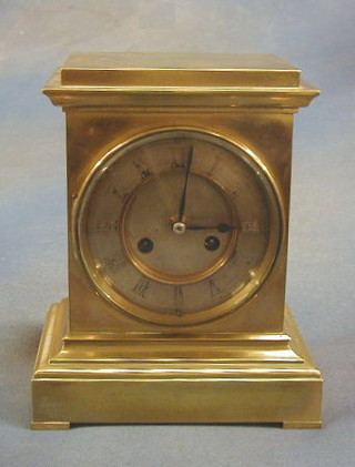 A 19th Century French gilt "bronze" striking mantel clock with silvered chapter ring and Roman numerals, striking on a gong