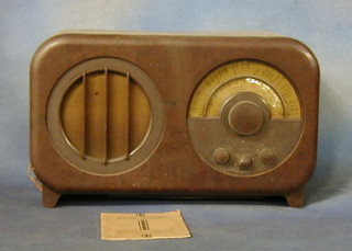 An Ecko type AC 85 radio contained in a brown Bakelite case complete with instruction book