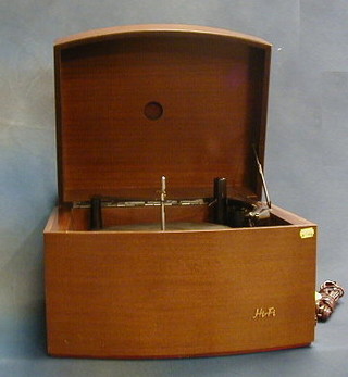 A Pye record player contained in a walnutwood bow front case