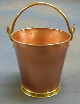 A copper pail with brass swing handle 7"