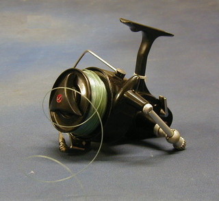 A Mitchel 386 multiplying fishing reel complete with instruction