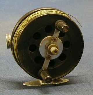 A black Bakelite and chrome Salmon Trulling Reel by Moores with leather drag system, patent applied for