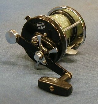 An Abu Ambassador 9000C fishing reel with instructions