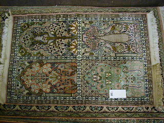 A fine quality mid 20th Century 4 division Persian silk rug with mosque entrance and floral decoration against a pink ground 36" x 24"