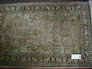 A fine quality Persian silk pink ground and floral patterned rug (some wear) 47" x 31"