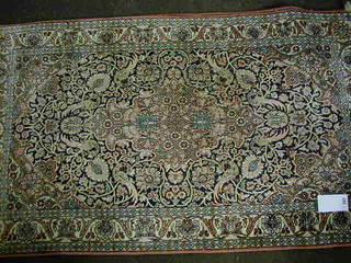 A fine quality Persian silk pink ground and floral patterned rug with central medallion decorated birds 52" x 30"