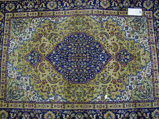 A contemporary yellow ground and floral pattern Persian design Belgian cotton rug 54" x 40"