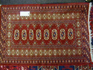 A small Bokhara rug with 8 octagons to the centre 36" x 25"