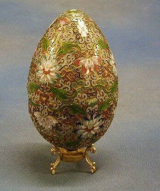 A champ leve enamel ornament in the form of a egg 7" (some dents)