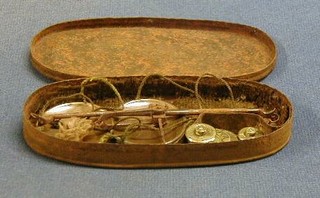 A pair of 18th Century copper and polished steel scales and 4 George III brass weights, contained in an oval steel case