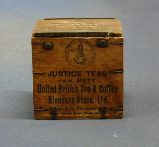 A miniature wooden tea chest marked Justice Tea 2 1/2lbs net United British Tea and Coffee Company Blenders Association Ltd 4"