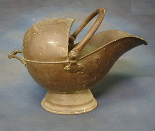 A copper helmet shaped coal scuttle