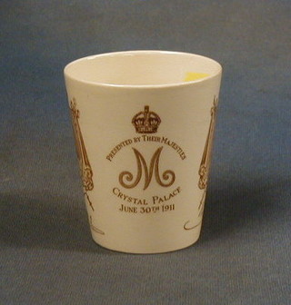 A  Royal Doulton George V Coronation beaker marked Presented by Their Majesty's Crystal Palace 3 June 1911