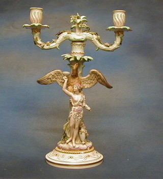 A 19th Century Meissen porcelain twin light candelabrum decorated a figure of a classical lady surmounted by an eagle, the base with crossed swords mark and incised 82K5C 15"