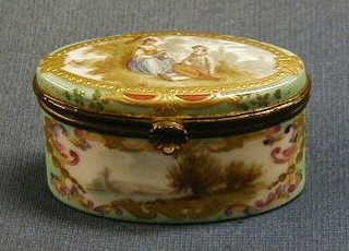 A Meissen style oval porcelain trinket box with hinged lid decorated Romantic scenes 3"